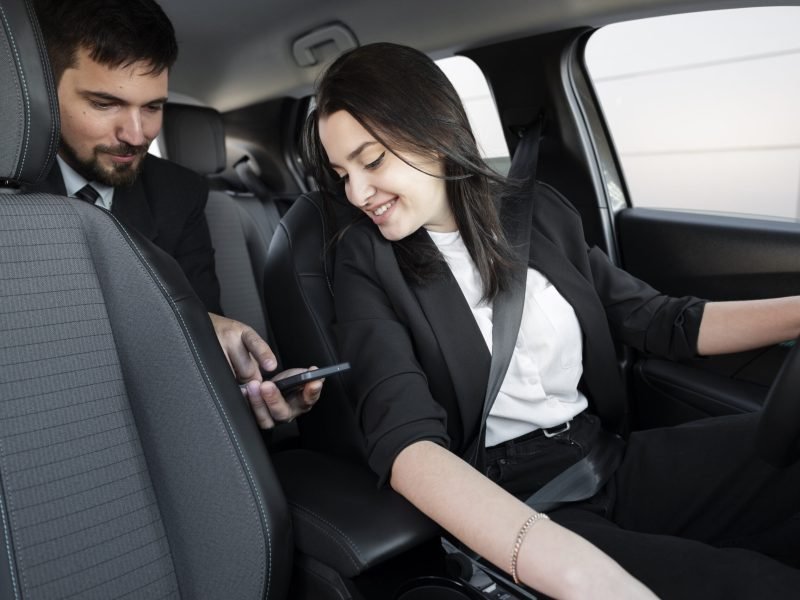 young-female-being-uber-driver-male-client (1)